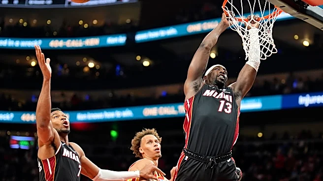 Giannis Antetokounmpo has 24 points, 18 rebounds as the Heat beat the Hawks 129-117 for first win