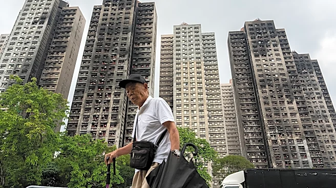 Hong Kong's housing minister resigns after fire investigation finds inadequate oversight