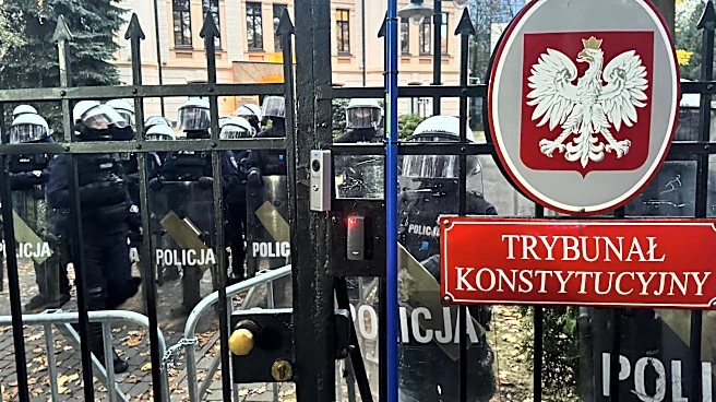 Protests erupt around a top court in Poland after its president is suspended