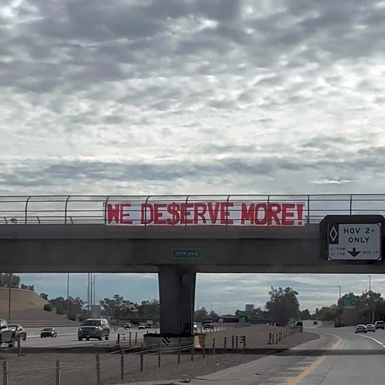 Giant Labor Day banners over I-10 freeway call for social justice