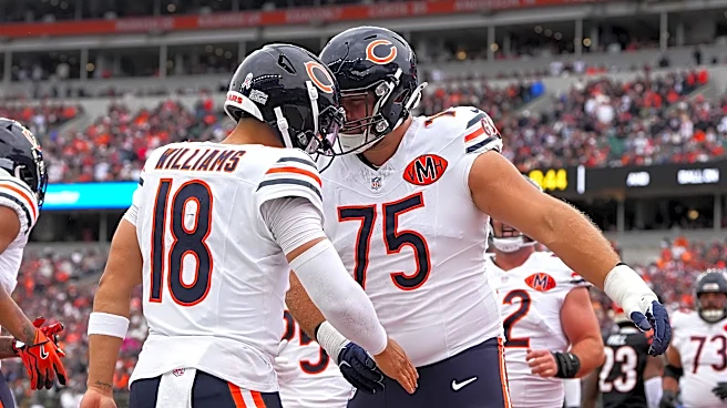 Caleb Williams reacts to Bears LT Ozzy Trapilo's return to practice