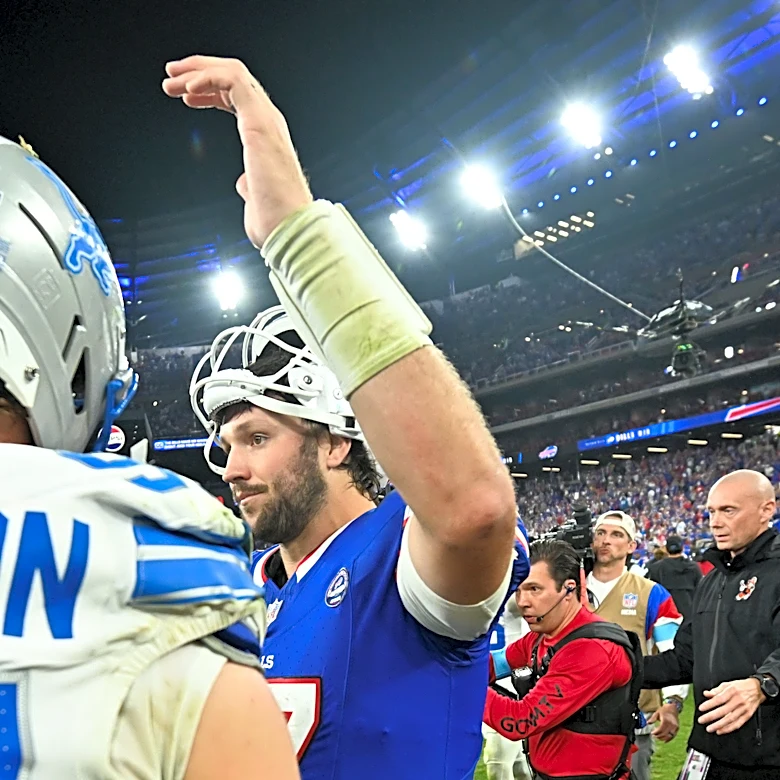 Bills players celebrate walking off field after first win at Highmark Stadium vs. Lions