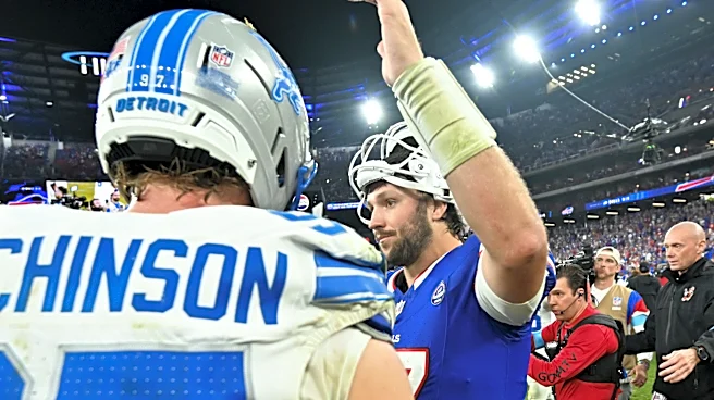 Bills players celebrate walking off field after first win at Highmark Stadium vs. Lions