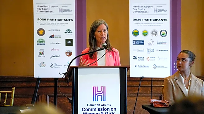 Which Cincinnati companies are committed to paying women equally?
