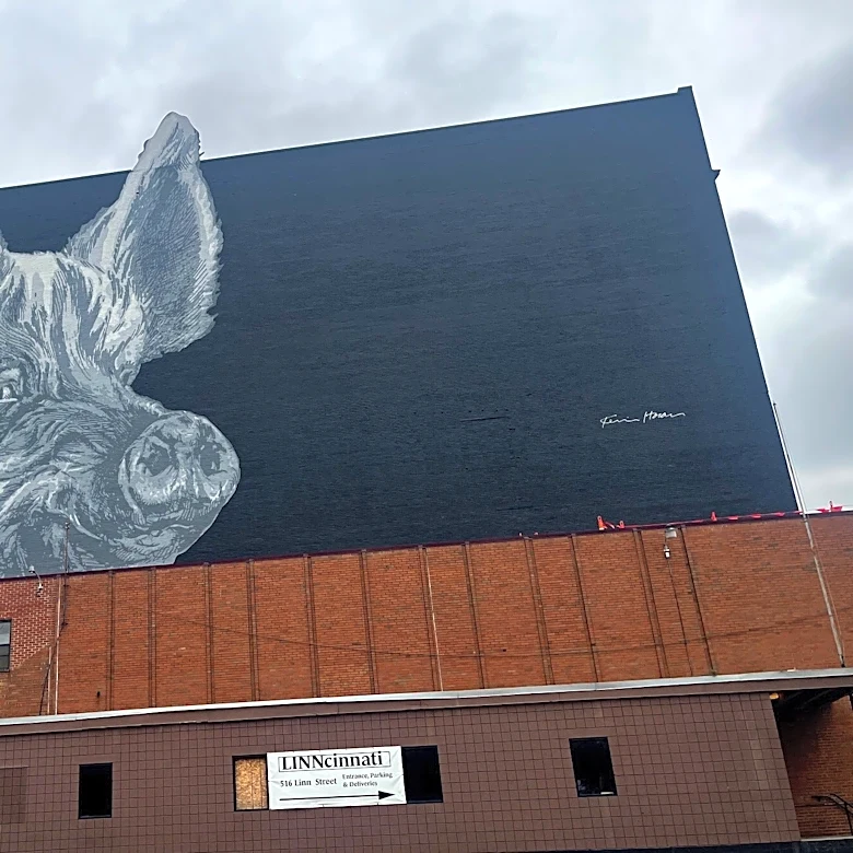 Who is the pig in the mural seen from US 50/Sixth Street? Just Askin'