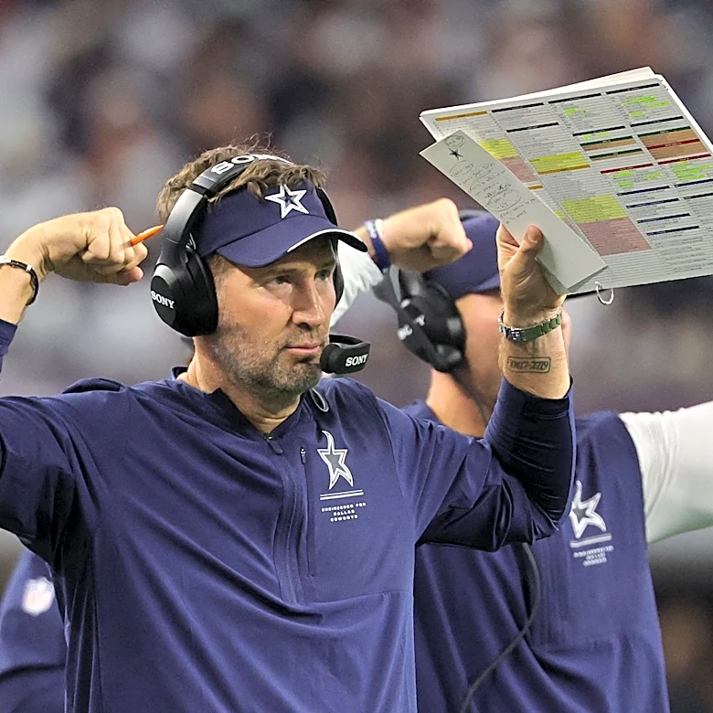 Cowboys coach Brian Schottenheimer acknowledges Jayden Daniels' injury after the game