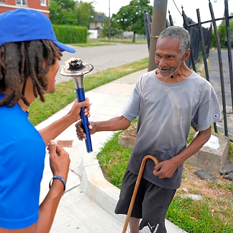 Runners carry Peace Torch across southeast Michigan