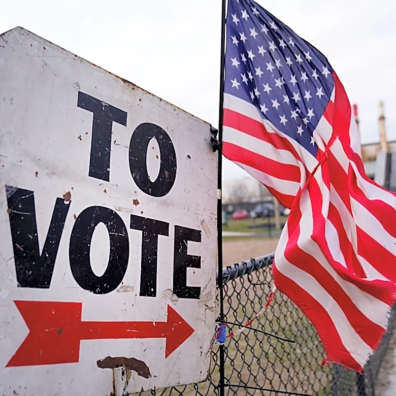 Can candidates or volunteers stand outside polls on Election Day?