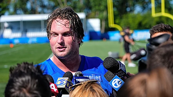 Lions OT Blake Miller solid in debut, thanks in part to Aidan Hutchinson