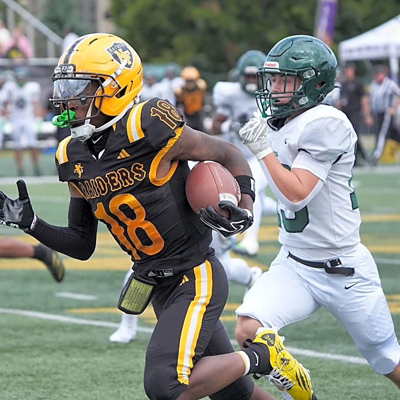 North Farmington's Eli Cobb shakes cramps to run past Birmingham Groves late