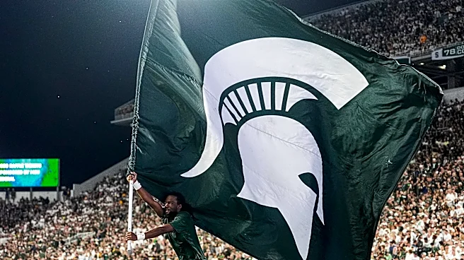 Michigan State OL throws up mid-play, RB loses pants during tackle