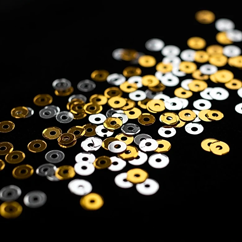 Why Plastic Sequins Made Sparkle More Wearable