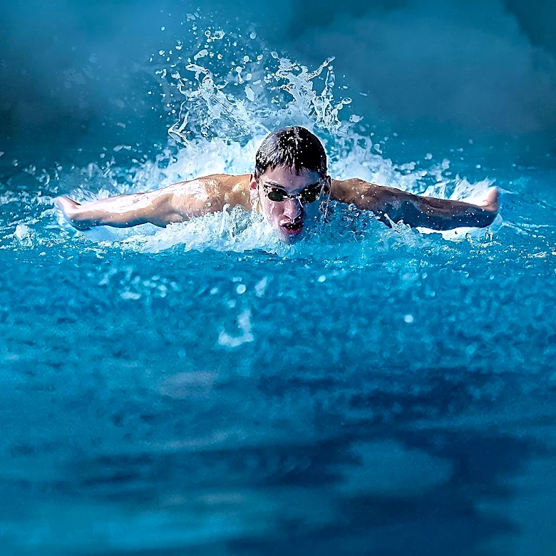 Phelps Broke the Olympic Record Twice on His Way to 100m Butterfly Gold