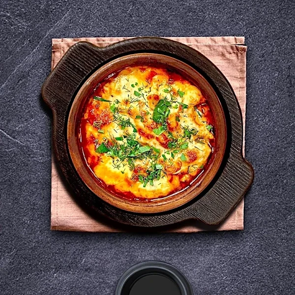 What Is Raclette, and How Did This Alpine Tradition Begin?