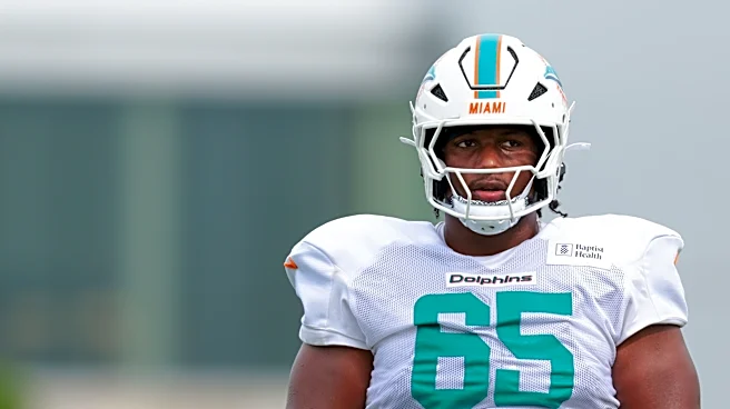 Dolphins bring back DL-turned-OL on their practice squad