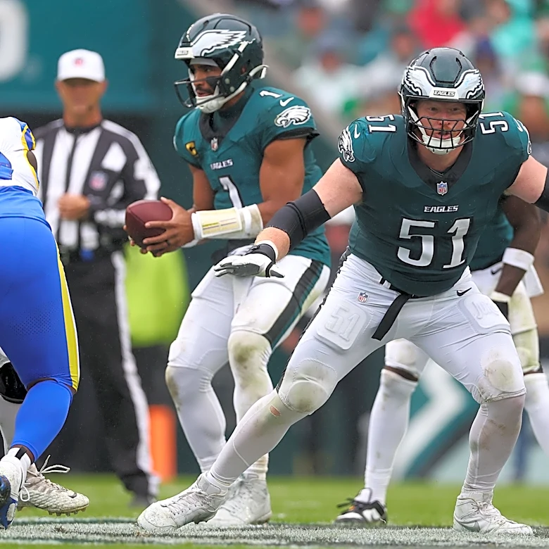 Nick Sirianni stands behind Cam Jurgens at left guard