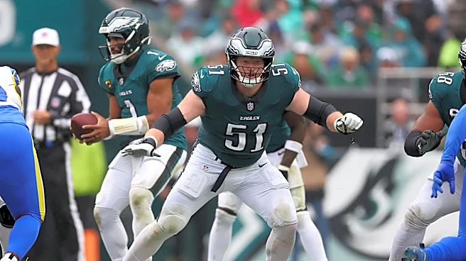 Nick Sirianni stands behind Cam Jurgens at left guard