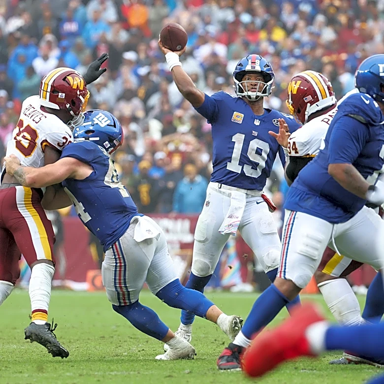Eagles stay in NFC East race as Giants, Commanders finish in a tie