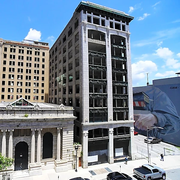 Quest for Laura Street Trio restoration in downtown gets new owner