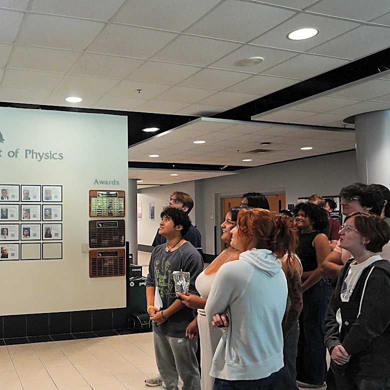 At UNF, fans watch Osprey pilot Dragon to International Space Station
