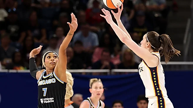 Caitlin Clark waves off DiJonai Carrington after bump during Fever-Sky