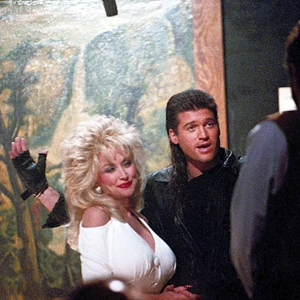 Miley Cyrus's dad pays tribute to her godmother Dolly Parton in touching post