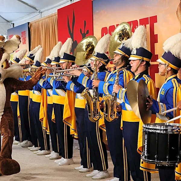 Wile E. Coyote celebrated 'Coyote vs. Acme' with a marching band entrance