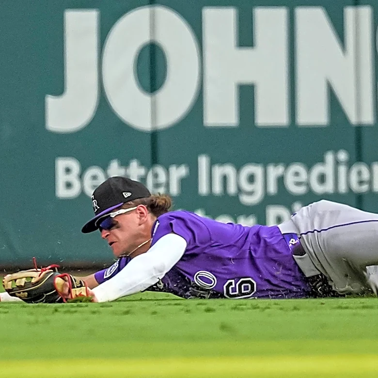 Rockies manager said he's benching rookie center fielder for flipping off Braves crowd