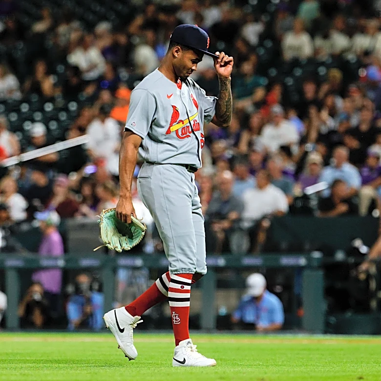 Cardinals, Rockies wore titled caps in support of rookie pitcher scolded by umpire