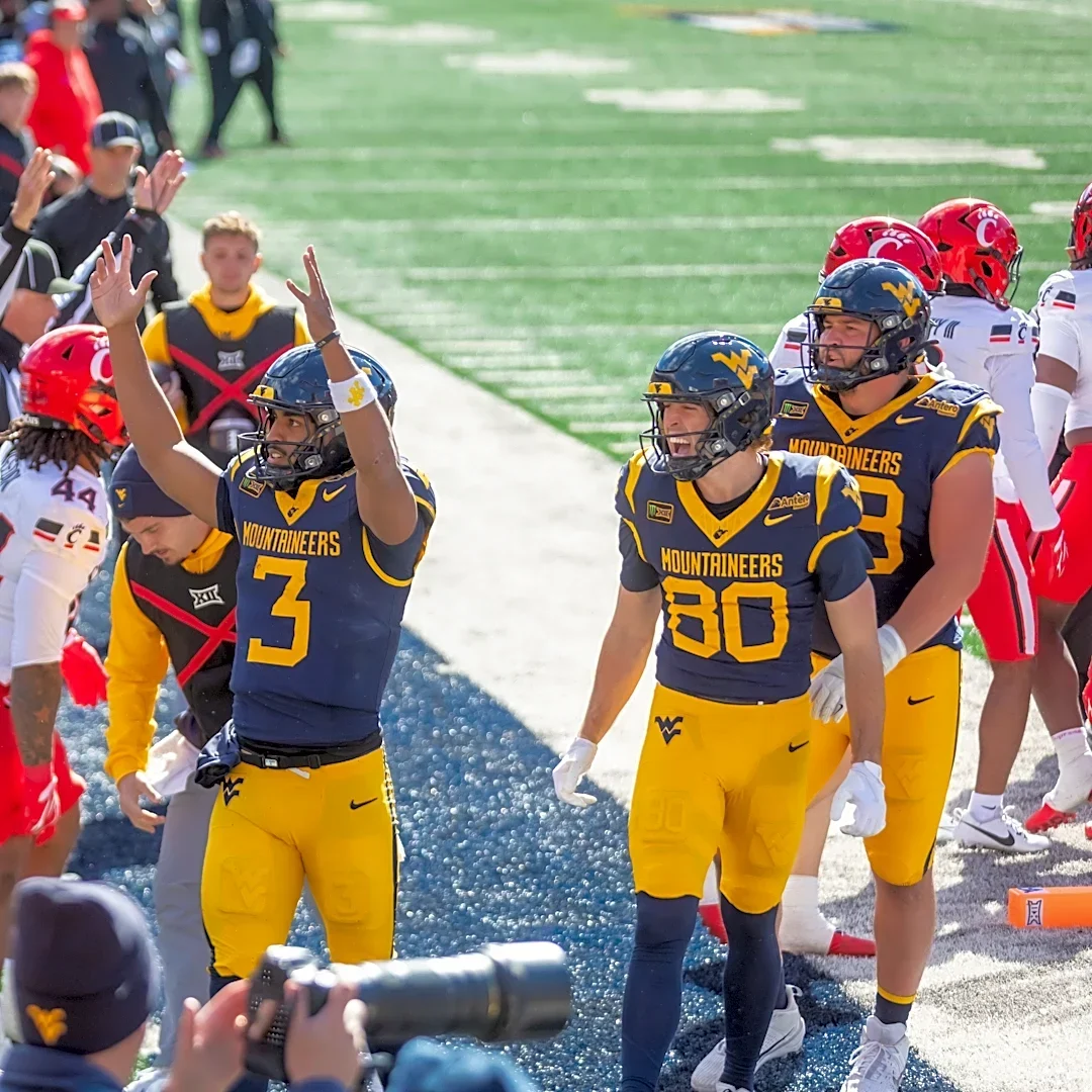 West Virginia cart driver accidentally backs injured Cincinnati player into wall