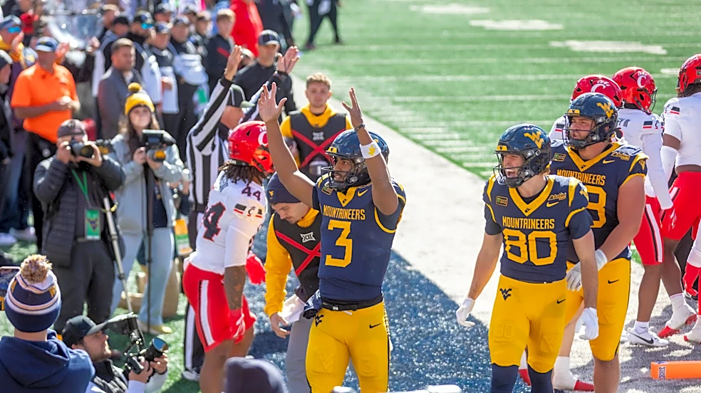 West Virginia cart driver accidentally backs injured Cincinnati player into wall