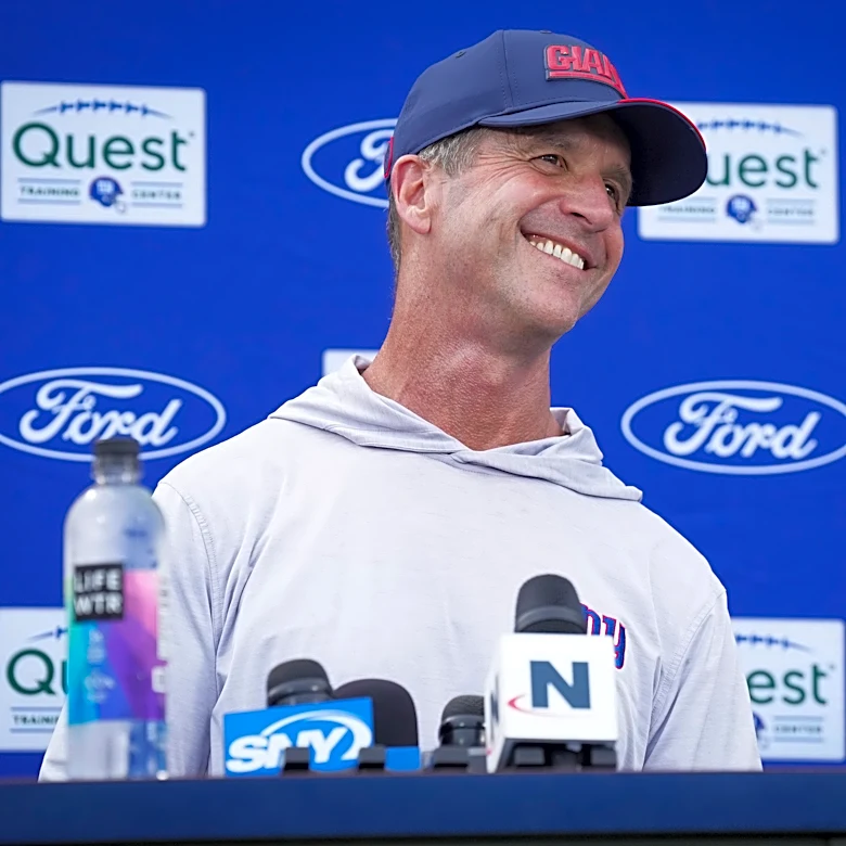 How many games is Giants coach John Harbaugh forecast to win in 2026?