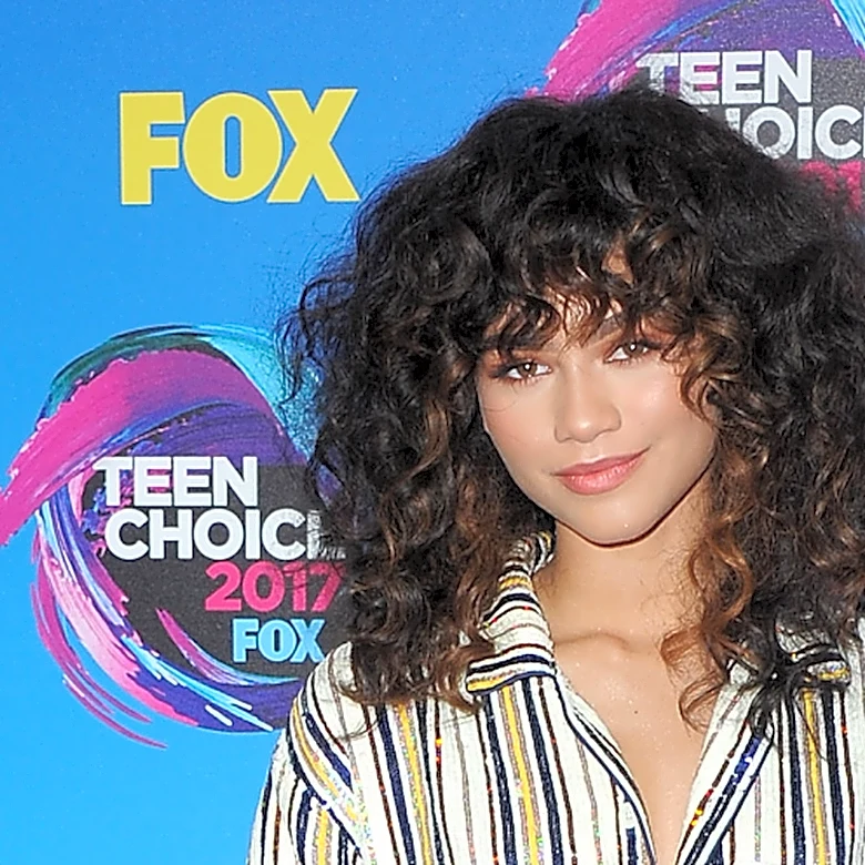 Celebs Who Rarely Let Their Curly Natural Hair Out To Play