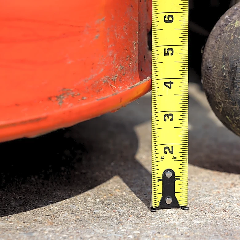 Should Lawn Mower Deck Wheels Touch The Ground?