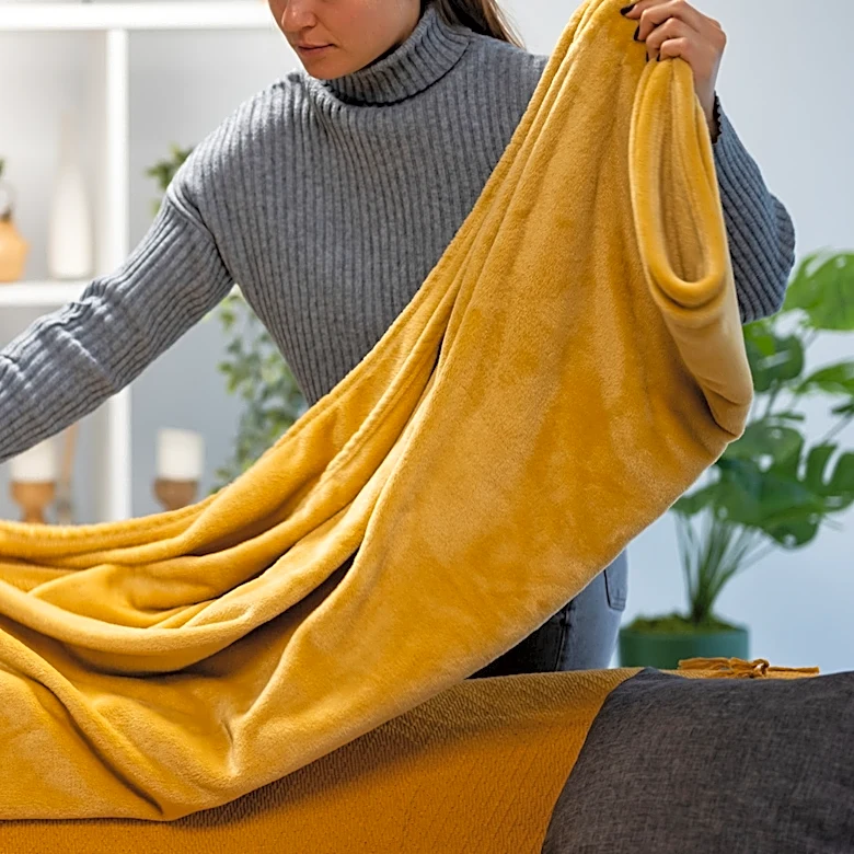 The Overlooked Trick To Prevent Blankets From Taking Up Extra Living Room Space