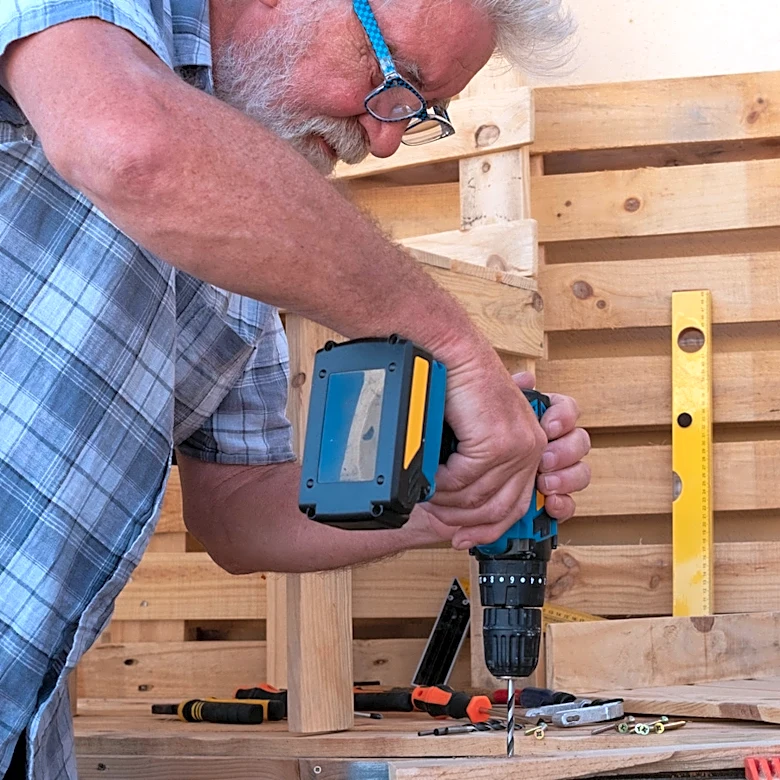 DIY Scrap Wood Pallets Into An Affordable Storage Solution For Your Lawn Mower