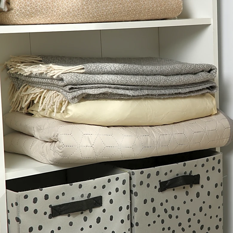 Ditch Overstuffed Shelves & Bins: A Better Way To Store Blankets Out Of Sight