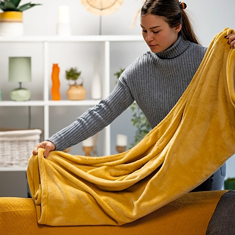 Upcycle An Old Wine Rack To Create Blanket Storage With A Clever DIY