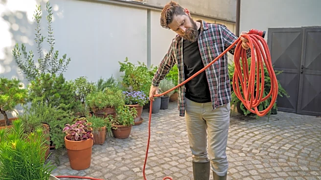 Use A Fence Post To Keep Garden Hoses Organized And Pretty