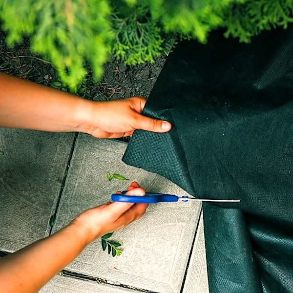 Not Landscape Fabric: There's An Easy To Use Alternative That'll Keep Your Garden Weed-Free