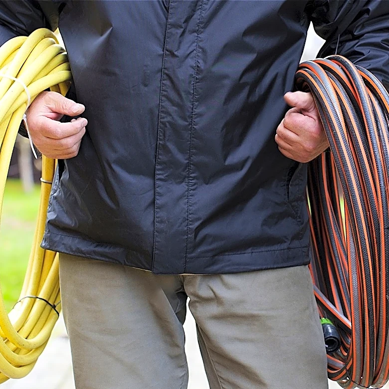 Use A Simple Chain To Keep Garden Hoses Neat & Organized