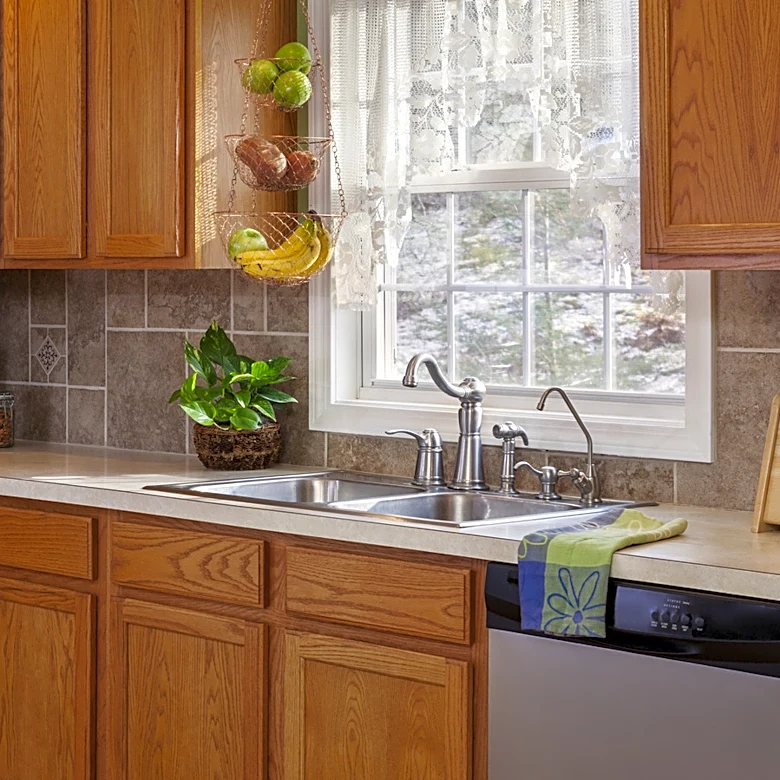 She Gives Orange Oak Cabinets A Moody Transformation With A Clever DIY