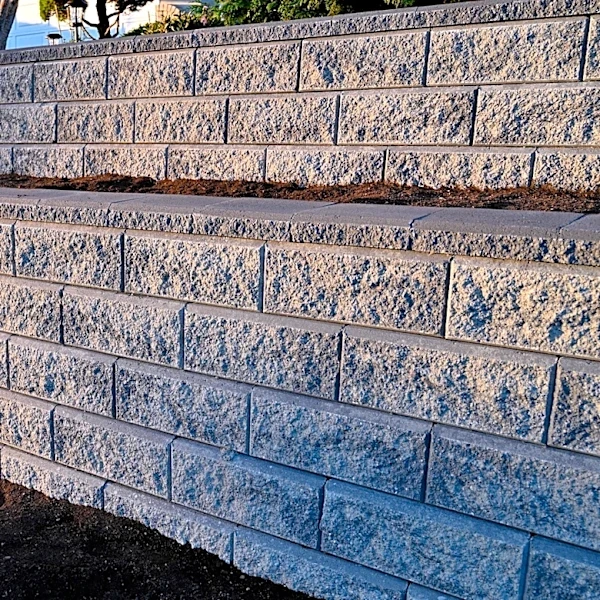 You Don't Need Concrete: Upgrade Your Retaining Wall With A Basic Yard Staple