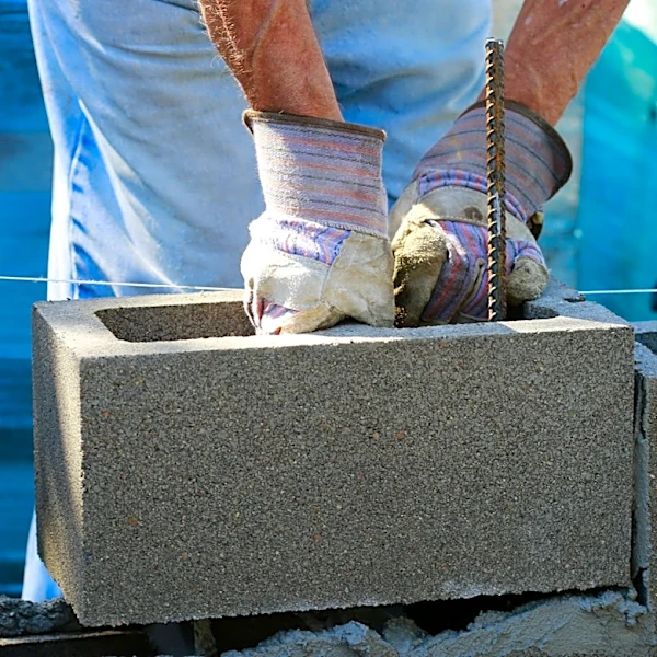 Gardener Uses Concrete Blocks To Make An Incredibly Easy-To-Build Garden Bench