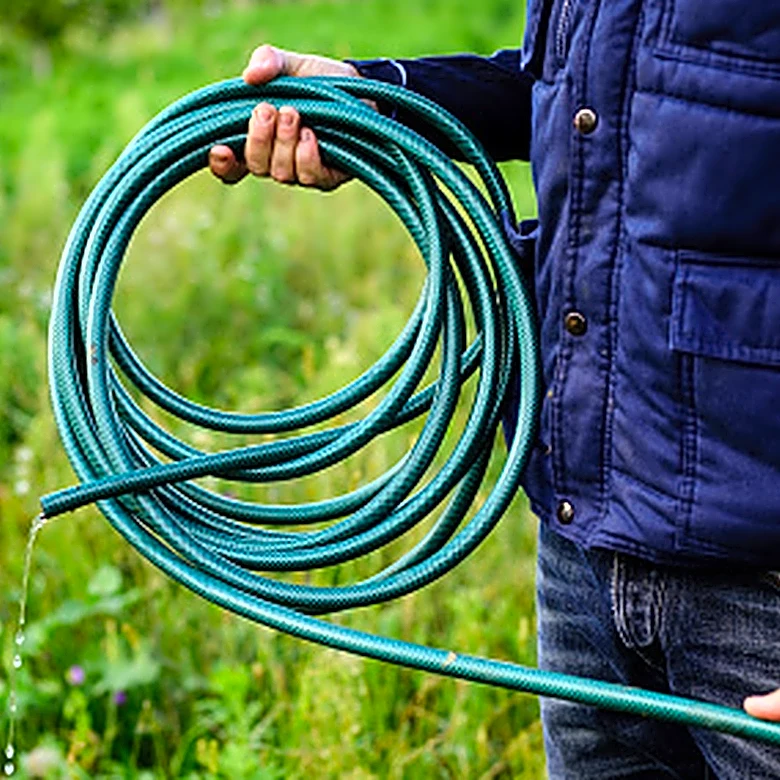 Gardener Builds An Epic Self-Watering Garden Bed Entirely From An Old Hose