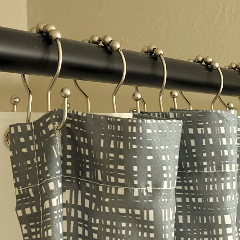 Keep Your Tension Shower Curtain Rod From Falling Down With This Tiny Hack