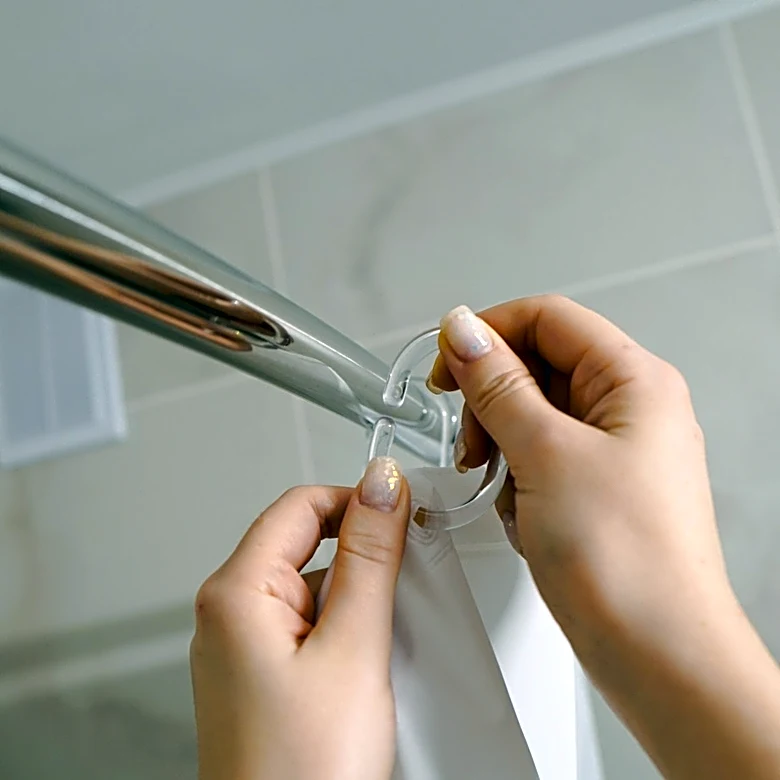 She Transforms Shower Rings Into A Shimmery Bead Curtain With A Clever DIY