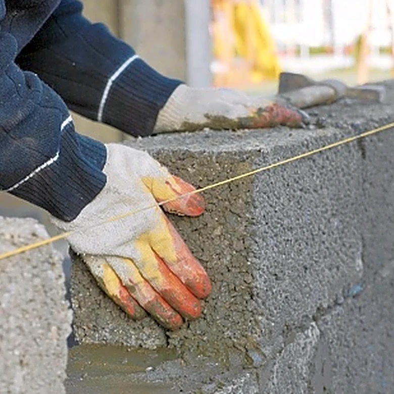 Say Goodbye To Concrete Blocks: Build A Patio Wall With A Natural Material