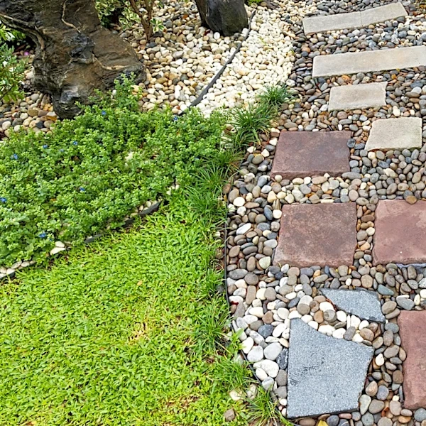 Easily Remove Gravel From Garden Beds With A Tool You Already Own