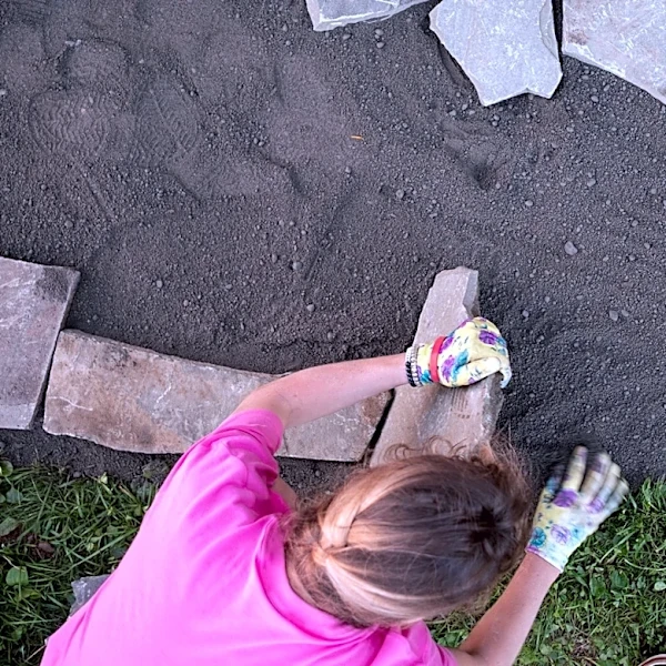 She Covers A Concrete Patio With A DIY Solution That Mimics Natural Stone Tile For Under $400